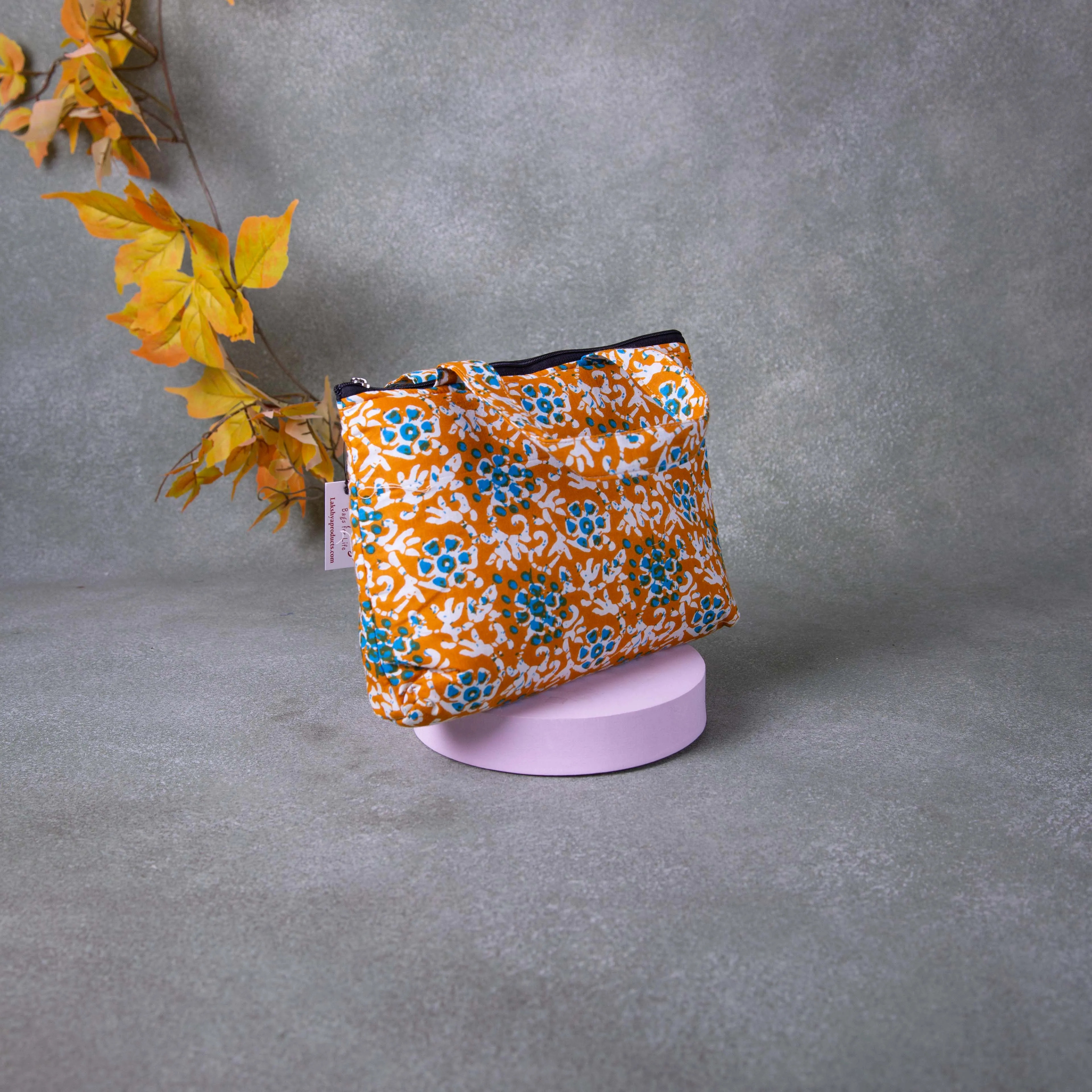 Bristlefront everyday handy bags Orange Colour with Blue and White Flower Design.